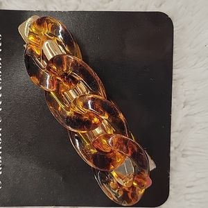Plastic tortoise shell colored chain hair clip
